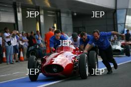 Stirling Moss in the Parade of Grand Prix Cars