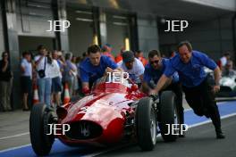 Stirling Moss in the Parade of Grand Prix Cars