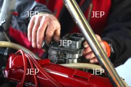 Silverstone Classic Media Day 2017, Silverstone Circuit, Northants, England. 23rd March 2017. A mechanic works on a Formula Ford. Copyright Free for editorial use.