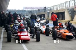 Silverstone Classic Media Day 2017, Silverstone Circuit, Northants, England. 23rd March 2017. Tiff Needell leads the Formula Ford field. Copyright Free for editorial use.