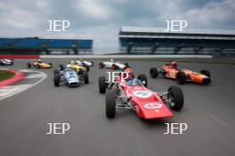 Silverstone Classic Media Day 2017, Silverstone Circuit, Northants, England. 23rd March 2017. Tiff Needell leads the Formula Ford field. Copyright Free for editorial use.