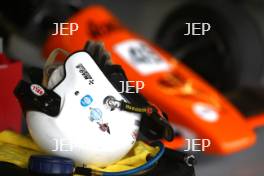 Silverstone Classic Media Day 2017, Silverstone Circuit, Northants, England. 23rd March 2017. Drivers helmet with an Arrows Formula One car. Copyright Free for editorial use.