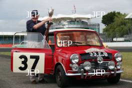 Silverstone Classic 2019 Mini Anniversary Parade Paddy Hopkirk at the Home of British Motorsport. 26-28 July 2019 Free for editorial use only  Photo credit – JEP