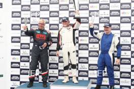 Silverstone Festival, Silverstone 2024, 23rd-25th August 2024. Free for editorial use only Race 2 Podium (l-r) 31 Peter Williams - LEC CRP1, 5 Carlos de Quesada - McLaren M26, 19 Chris Perkins - Surtees TS16  